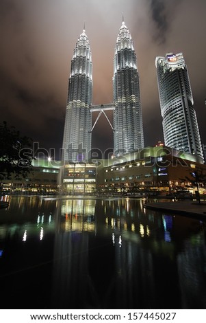 KUALA LUMPUR, MALAYSIA - OCT 3: Petronas Twin Towers at night on October 3, 2009 in Kuala Lumpur. Petronas Twin Towers were the tallest buildings (452 m) in the world from 1998 to 2004.