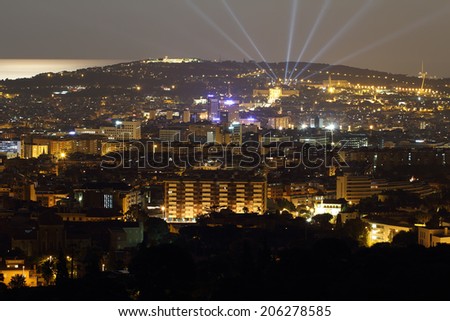BARCELONA, SPAIN - JULY 12: Barcelona skyline at night with mountain of Montjuic at background on July 12, 2014 in Barcelona