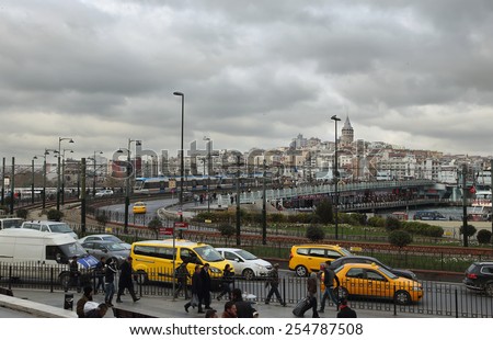 ISTANBUL, TURKEY - NOVEMBER 27: View of the hectic daily life, yellow cabs and famous Galata Bridge on November 27, 2014 in the historical center of Istanbul, Turkey.