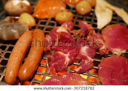 Korean barbecue - meat are being cooked on stove.