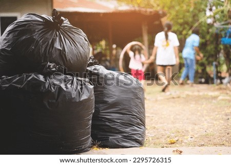 Similar – Foto Bild Müllsäcke stapeln sich vor einer Scheibe, in der sich ein modernes Wohngebäude spiegelt