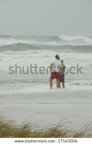 PENSACOLA - SEP 1, 2008: A lifeguard warns a man that the surf is too dangerous during Hurricane Gustav on September 1, 2008.  Gustav claimed the lives of more than 130 people.