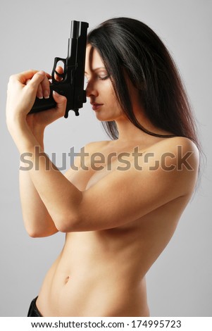 Chubby teen poses naked Naked woman holding a gun
