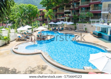 PHUKET THAILAND - December 5 : Family swim in pool at The Luxury resort in Kata beach,2013 in Phuket,Thailand