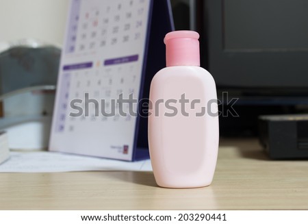 Pink Lotion Bottle on the table