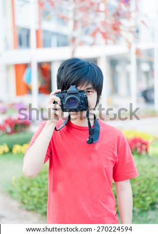 Asian man Using Film Camera with no logo