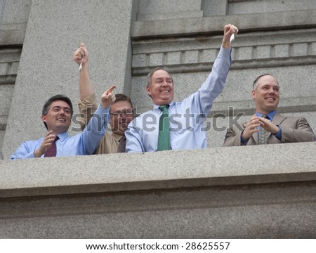 DENVER - APRIL 15: Members of Colorado\'s House, Senate and Aides hold up tea bags during the Tea Party at the Colorado Capitol, April 15, 2009 in Denver.