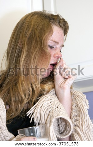 BOULDER - SEPT 14: A 15-year old girl coughs as she tries to recover from Tamiflu on September 14, 2009 in Boulder. The child is trying to recover from Influenza A subtype, H1N1.