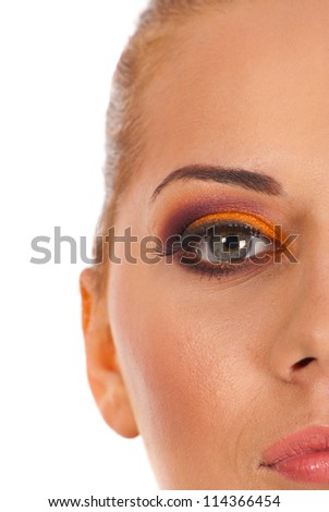 Half part of woman face with glamour makeup over white background