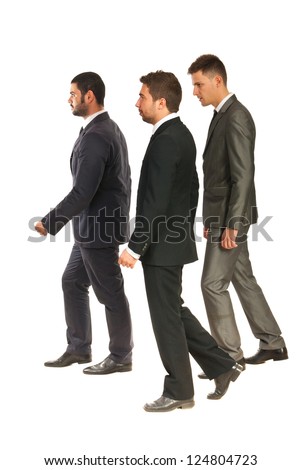 Profile of three business men walking  to work isolated on white background