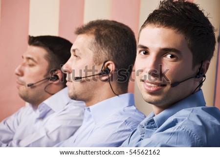 Three men support team working,focus on first man which smiling and looking you