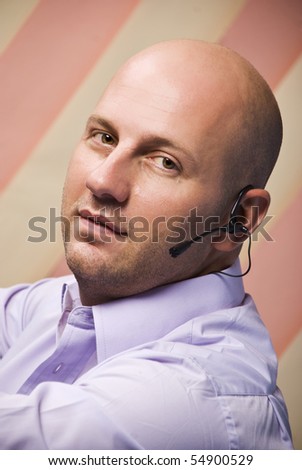 Portrait of bald man customer service rep looking at camera