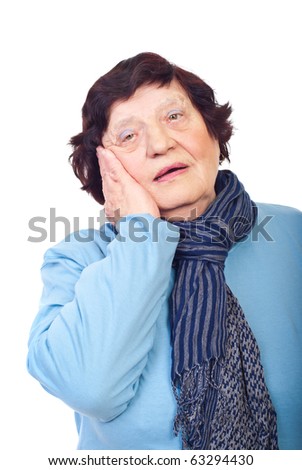 Worried senior woman holding hand on  face isolated on white background