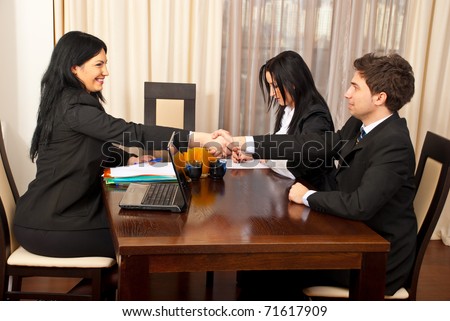 Successful job interview  ,two business people giving hand shake and smiling