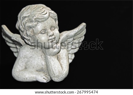 gypsum sculpture of an angel on black, close up, macro, detail, full frame / Dreaming Angel