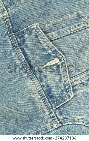 close up of a blue denim jacket with pocket, unbuttoned, macro, detail, full frame, slanted, tilt, vertical / Denim Jacket, Detail, vertical
