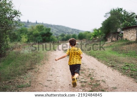 Similar – Image, Stock Photo Boy kid walking on wet sunny beach