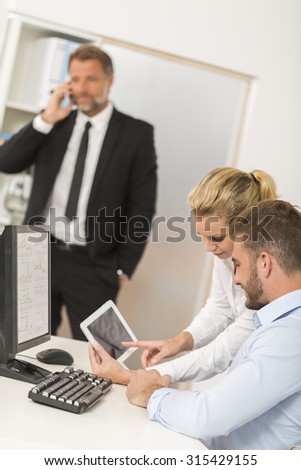 business people working in office on desktop computer