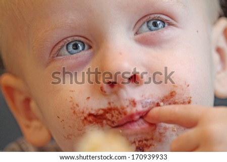 Boy eating cookie