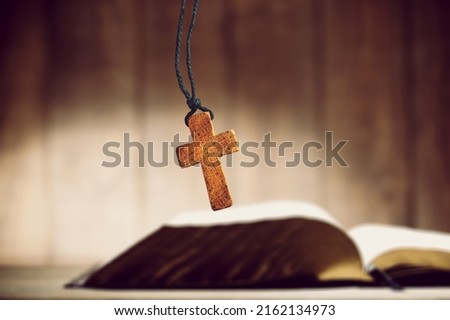 Against the background of the Holy Bible a Catholic cross. Meditation, prayer, catholicism, christianity, jesus christ. Foto d'archivio © 