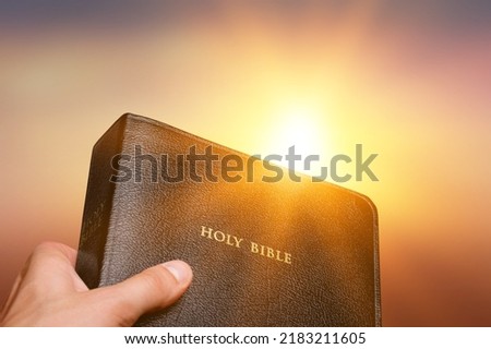Man hands praying to god with the bible. Believe in goodness. Holding hands in prayer. Power of hope or love and devotion. Foto d'archivio © 