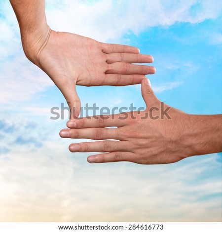 Hands, sky, fingers.