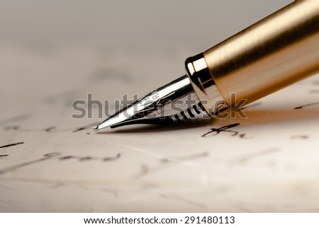 Close Up Of Fountain Pen Or Ink Pen With Notebook Paper On Wooden