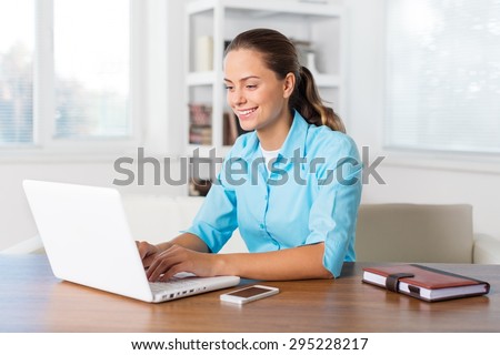 Woman, laptop, swivel chair.