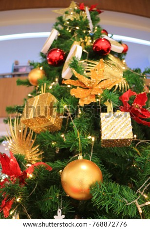low angle view of a decorated big christmas tree full of gorgeous ornaments - Big Christmas Ornaments low angle view of a decorated big christmas tree full of gorgeous ornaments - Big Christmas Ornaments