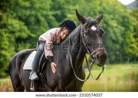 Similar – Foto Bild Kleines Mädchen reitet Pferd auf dem Hippodrom