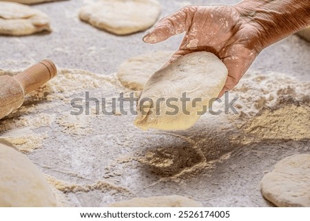 Similar – Image, Stock Photo Baker rolling out dough in kitchen