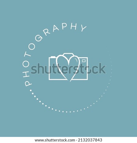 Photography stamp logo design. Camera icon with heart shaped lens white logo with blue background.