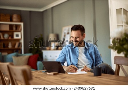 Similar – Image, Stock Photo Young Man smiling while talking to someone on his laptop.
