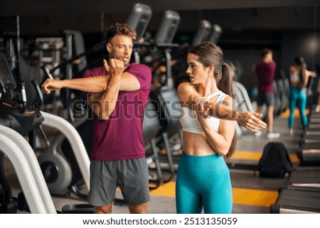 Similar – Image, Stock Photo Flexible man training on aerial straps