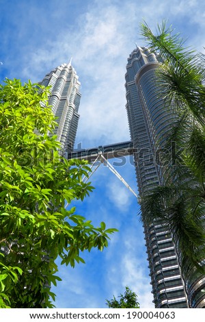 KUALA LUMPUR, MALAYSIA - JANUARY 8: Petronas Twin Towers at day on January 8, 2014 in Kuala Lumpur. Petronas Twin Towers were the tallest buildings (452 m) in the world from 1998 to 2004