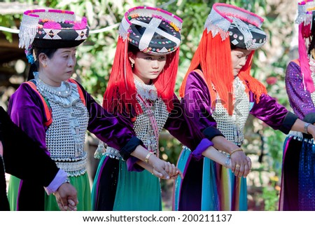 LISU, THAILAND - FEBRUARY 7: Ritual dance of women in national costumes during Spring Festival (Chinese New Year) in mountain village of Lisu, province of Mae Hong Son, Thailand, February 7, 2014