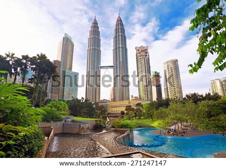 KUALA LUMPUR, MALAYSIA - JANUARY 8: Petronas Twin Towers at day on January 8, 2014 in Kuala Lumpur. Petronas Twin Towers were the tallest buildings (452 m) in the world from 1998 to 2004