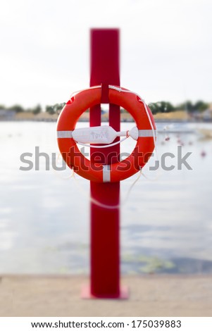 Life ring, lifesaver hanging on post in PÃ?Â?Ã?Â¤rnu yacht club marina in Estonia. PÃ?Â?Ã?Â¤rnu river, water.