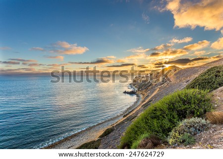 The sun sets over the Point Vicente lighthouse at Pelican Cove in California.