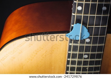 Acoustic guitar body and guitar pick isolated