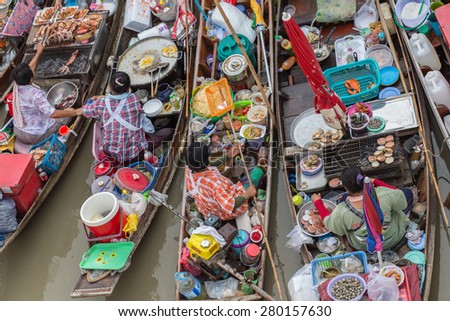 AMPHAWA,THAILAND-DE May 10 Trader\'s boats in Amphawa floating Market, 110 km from Bangkok, most famous floating market and cultural tourist destination on May 10, 2015 in Amphawa, Thailand.