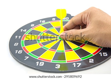 Setting goal or accurate planning, hand going to take dart into the center of dartboard