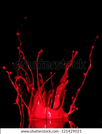 Red paint splash  on black background