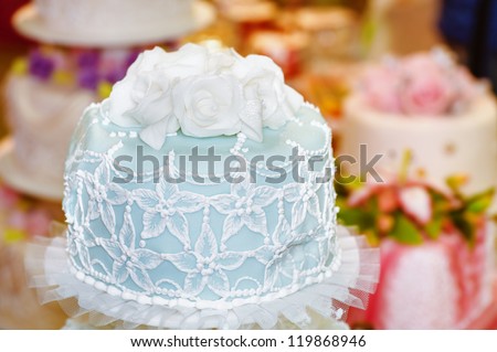 Beautiful large cake decorated with mastic as roses.