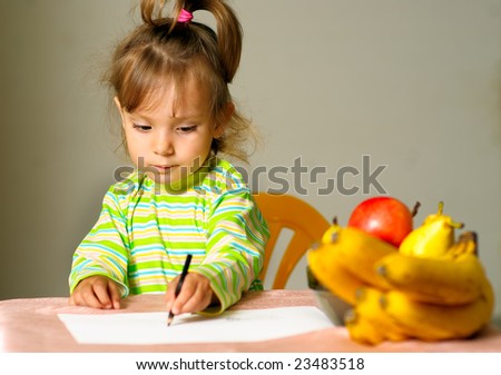 Little girl draws pencil on paper about ripe fruit.