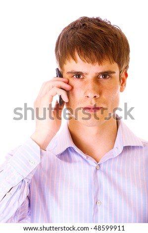 Handsome young guy speaking on cellphone, isolated on white background.