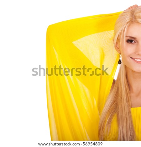 Half beautiful woman in yellow dress has lifted hands and smiles, it is isolated on white background.