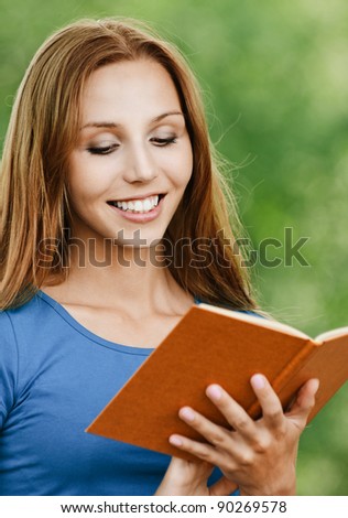 portrait beautiful woman student reading book smiling background summer green park