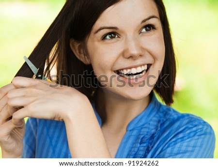 portrait young charming woman smiling scissors trim yourself short hair background summer green park