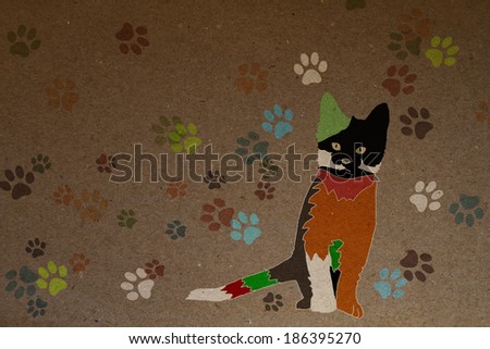 funny fashionable colored kitten, colorful traces of paws, paper texture